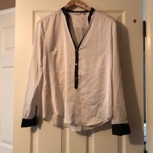 White and black satin blouse with gold buttons
